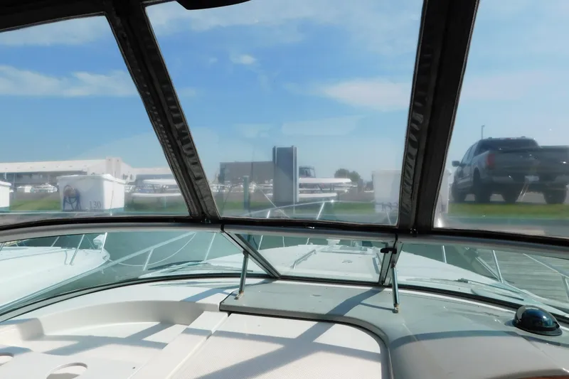 Slide: The Image of 2009 Bayliner 300 boat interior view through windshield at marina. - 39