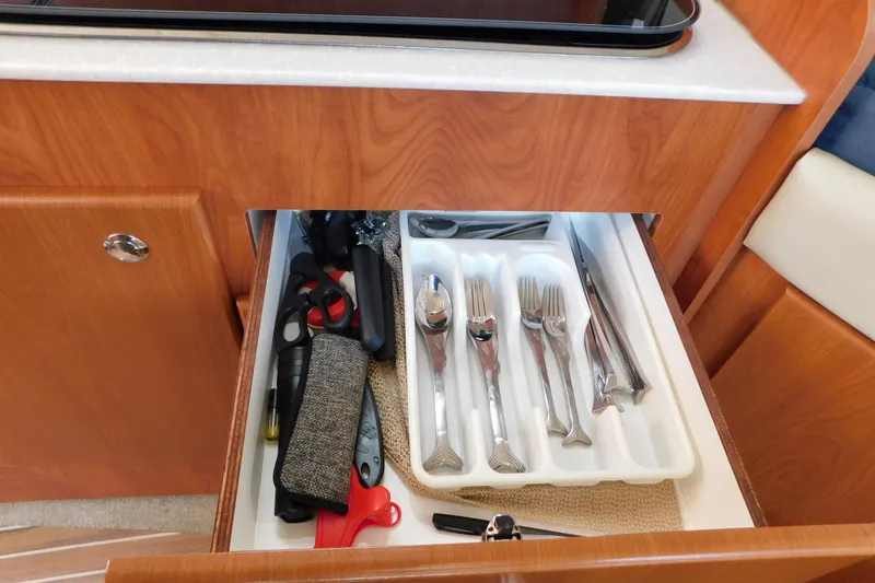 Slide: The Image of Drawer in 2009 Bayliner 300 yacht with cutlery and kitchen tools. - 68