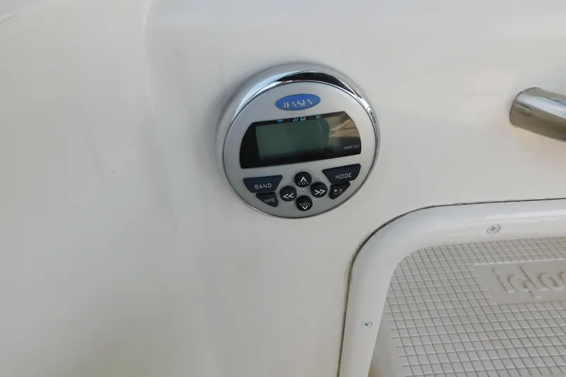 Slide: The Image of Jensen stereo control panel on 2009 Bayliner 300 boat interior. - 23