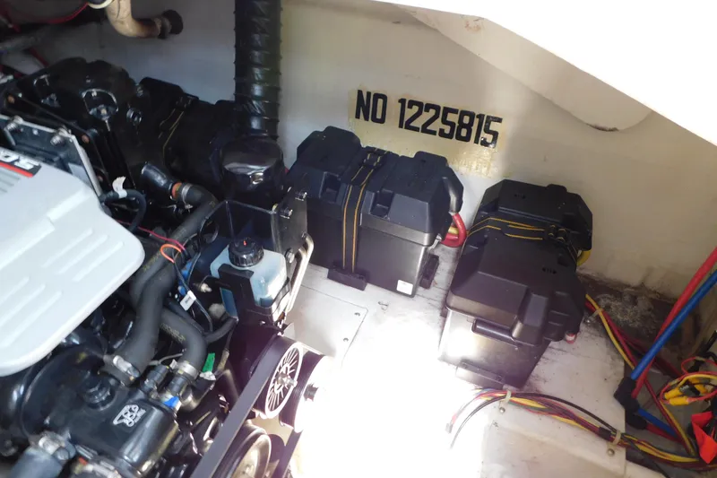 Slide: The Image of Engine compartment of 2009 Bayliner 300 boat, showing batteries and wiring. - 94