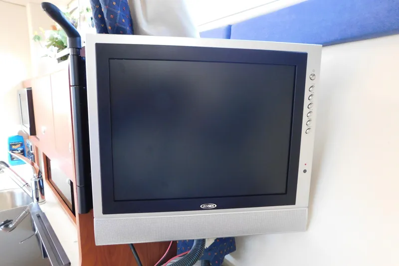 Slide: The Image of Flat-screen TV mounted inside a 2009 Bayliner 300 boat cabin. - 56