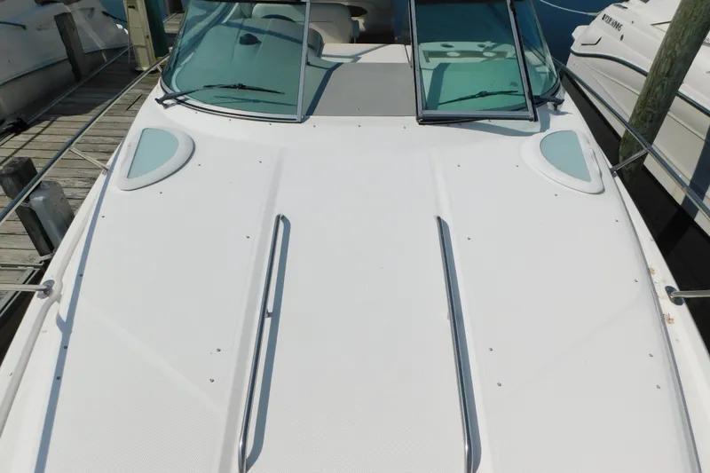 Slide: The Image of 2009 Bayliner 300 boat deck with windshield, docked at marina. - 44