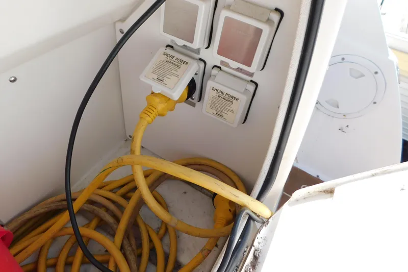 Slide: The Image of Shore power connection on 2009 Bayliner 300 boat with yellow cables. - 15