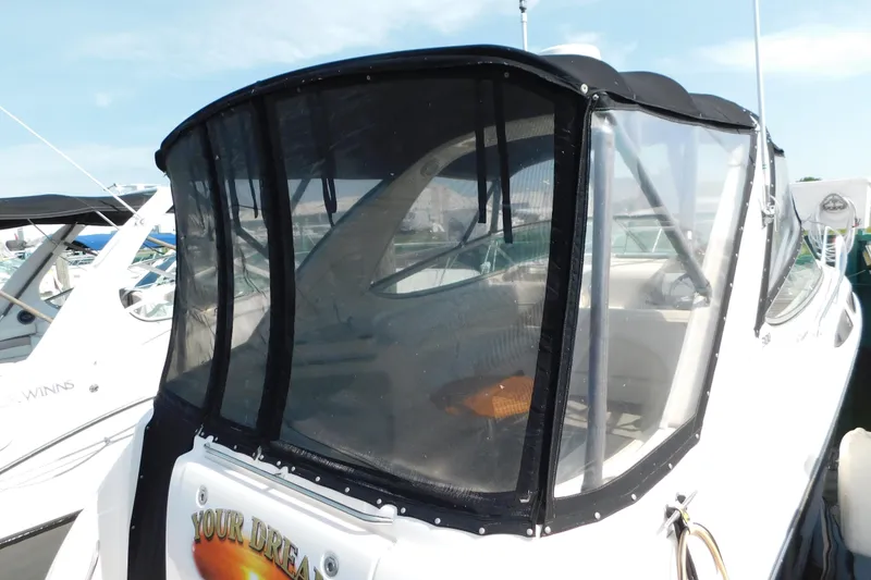 Slide: The Image of 2009 Bayliner 300 boat with enclosed cockpit at marina. - 8