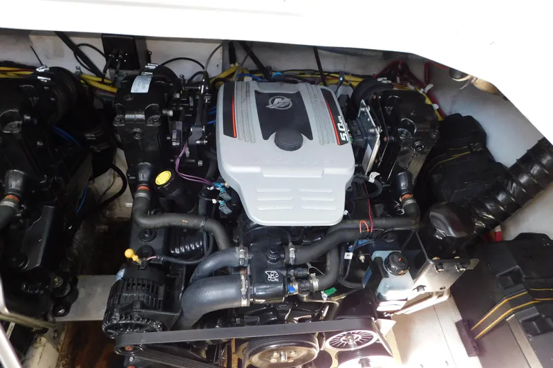 Slide: The Image of Engine compartment of a 2009 Bayliner 300 boat, showcasing detailed mechanical components. - 93