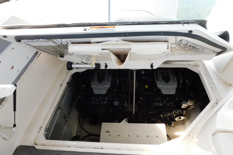 Slide: The Image of Engine compartment of a 2009 Bayliner 300 boat, showcasing dual engines. - 90