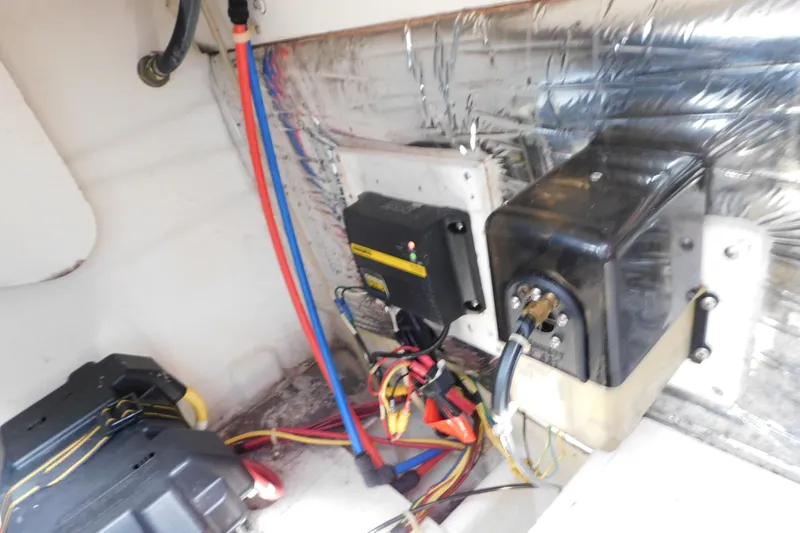 Slide: The Image of Electrical components and wiring inside a 2009 Bayliner 300 boat. - 96