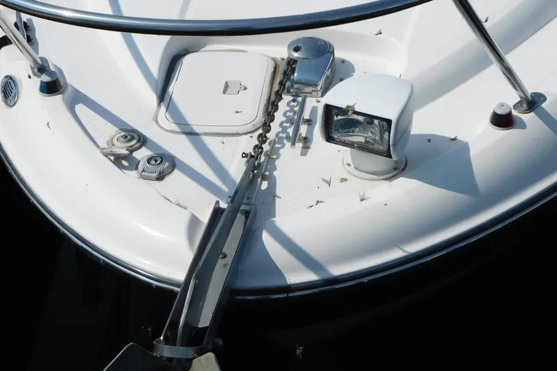 Slide: The Image of Bow of 2009 Bayliner 300 boat with anchor chain and deck equipment. - 1