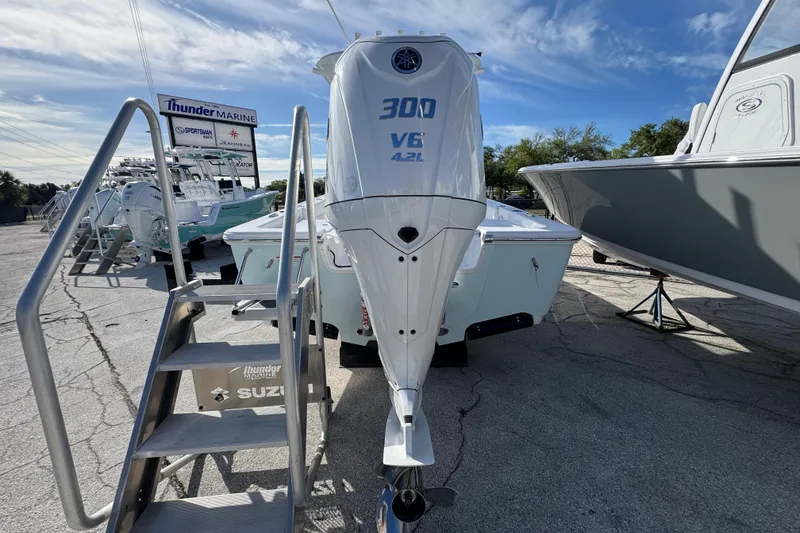 Slide: The Image of 2026 Sportsman Masters 247 Bay Boat with powerful 300 V6 engine at Thunder Marine dealership. - 2