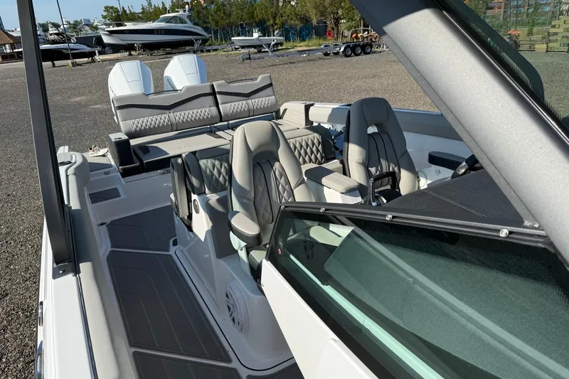 Slide: The Image of 2027 Monterey Elite 30 OB boat interior with luxurious seating and modern design. - 7