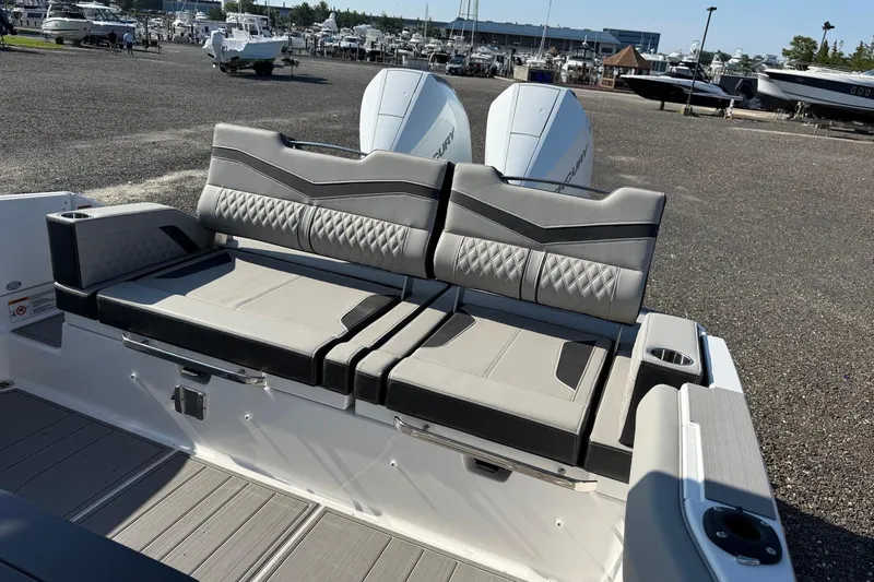 Slide: The Image of Luxury seating on 2027 Monterey Elite 30 OB boat, featuring sleek design and dual engines. - 13