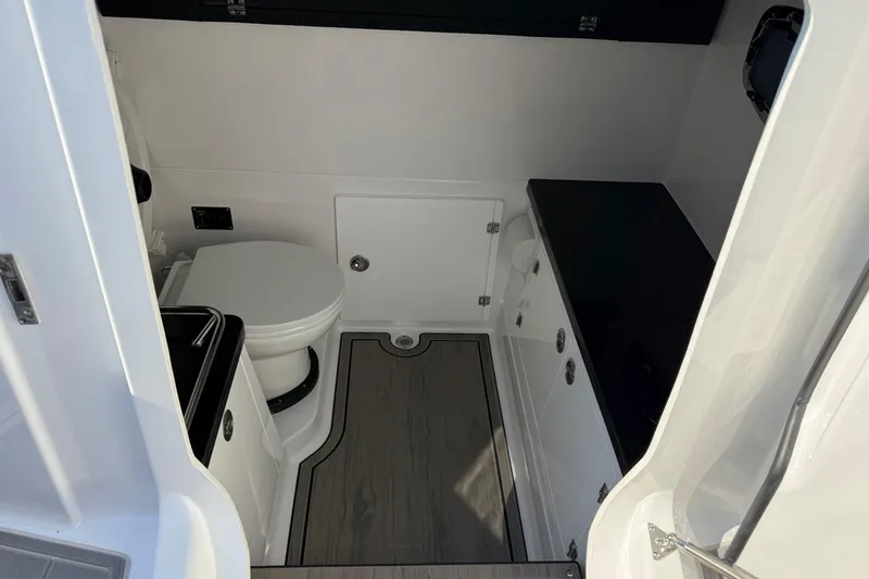 Slide: The Image of 2027 Monterey Elite 30 OB boat interior with modern bathroom amenities. - 11
