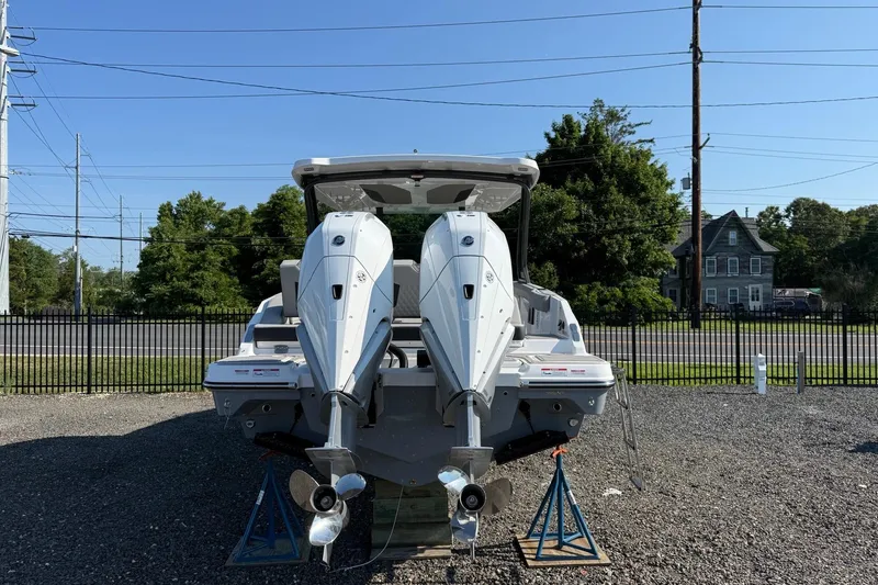 Slide: The Image of 2027 Monterey Elite 30 OB boat with dual outboard engines on display. - 16