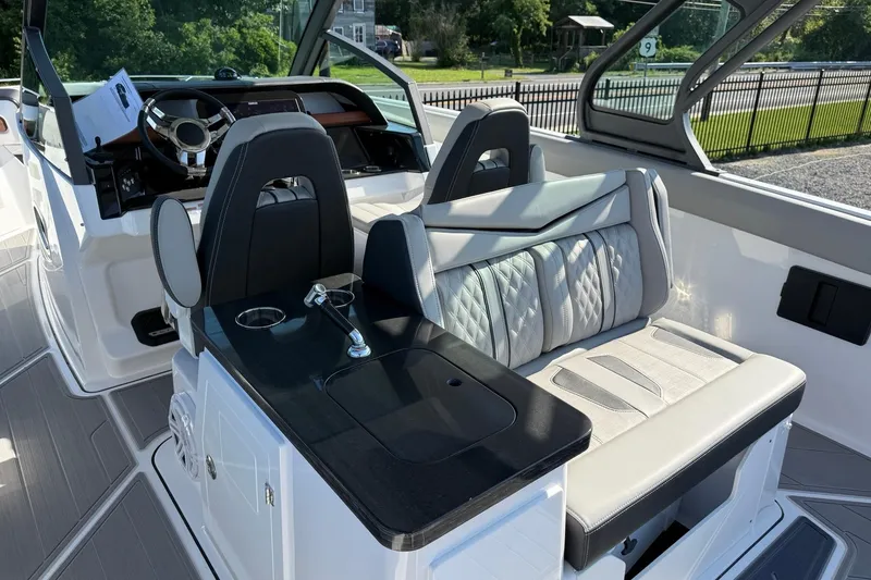 Slide: The Image of Interior of 2027 Monterey Elite 30 OB boat with modern seating and steering wheel. - 15