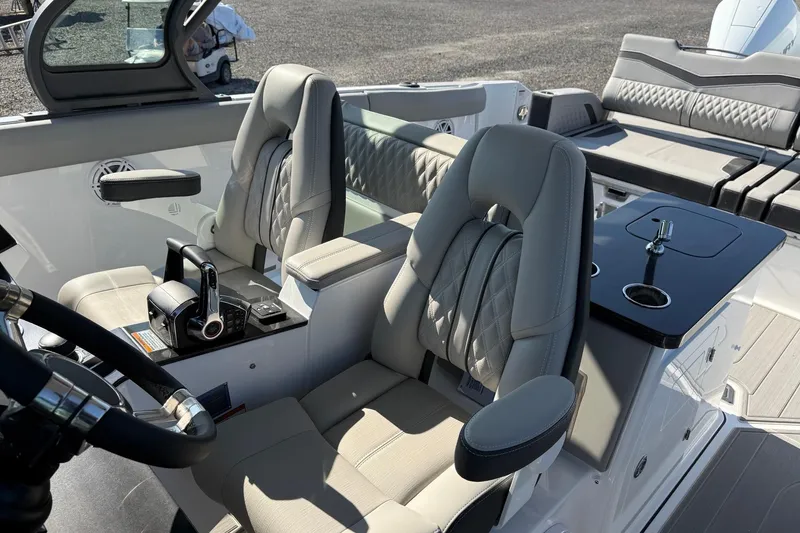 Slide: The Image of Luxurious interior of 2027 Monterey Elite 30 OB boat with plush seating and modern controls. - 9
