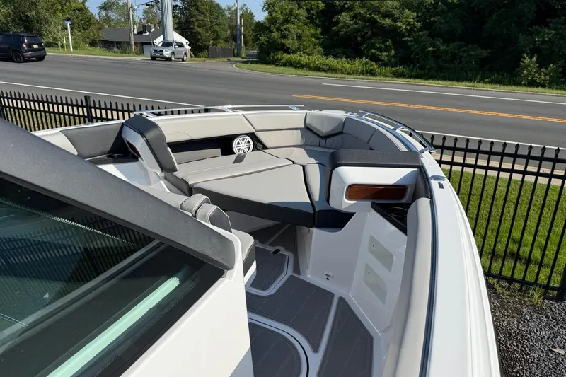 Slide: The Image of 2027 Monterey Elite 30 OB boat interior with sleek seating and modern design. - 4