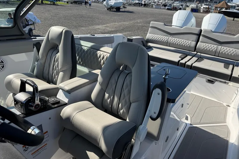 Slide: The Image of 2027 Monterey Elite 30 OB boat interior with luxurious seating and modern controls. - 8