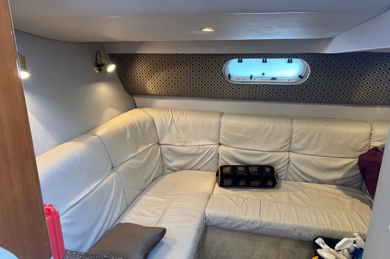 Slide: The Image of Interior of 2003 Formula 37 Performance Cruiser with white leather seating and decorative window. - 55