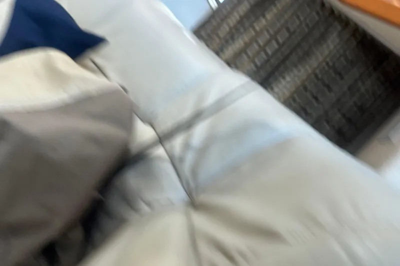 Slide: The Image of Blurry interior view of a 2003 Formula 37 Performance Cruiser with cushions and upholstery. - 57