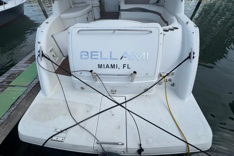 Slide: The Image of 2003 Formula 37 Performance Cruiser docked, rear view with "Bellami" and "Miami, FL" text. - 15