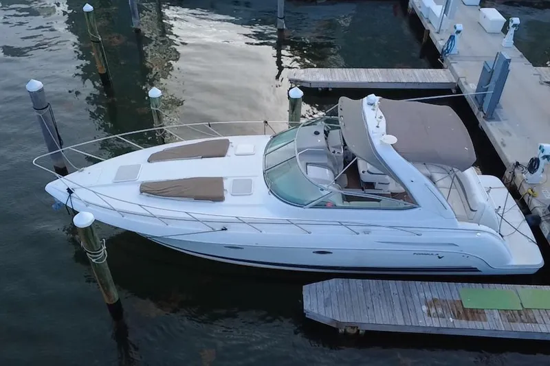 Slide: The Image of 2003 Formula 37 Performance Cruiser docked at marina, aerial view. - 5