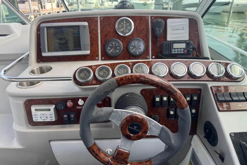 Slide: The Image of Steering console of a 2003 Formula 37 Performance Cruiser with gauges and navigation equipment. - 30