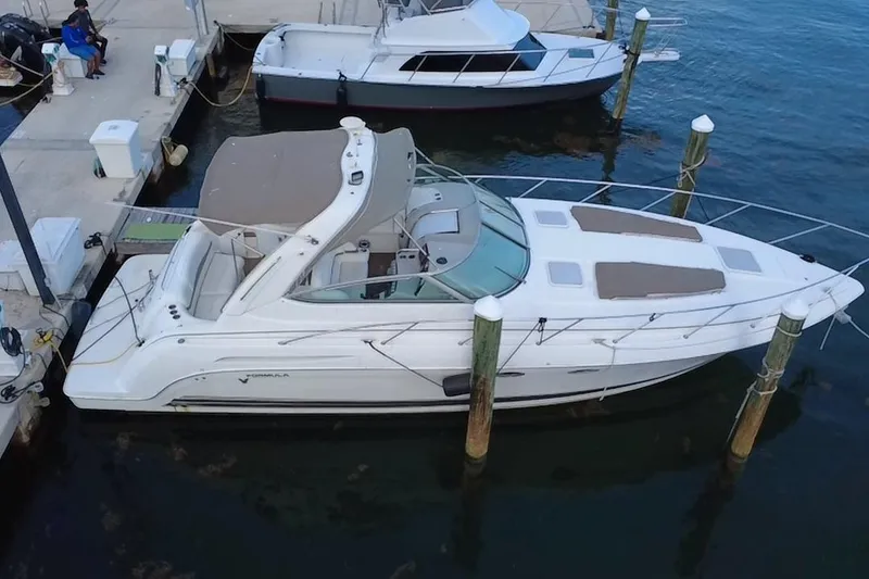 Slide: The Image of 2003 Formula 37 Performance Cruiser docked at marina, aerial view. - 1