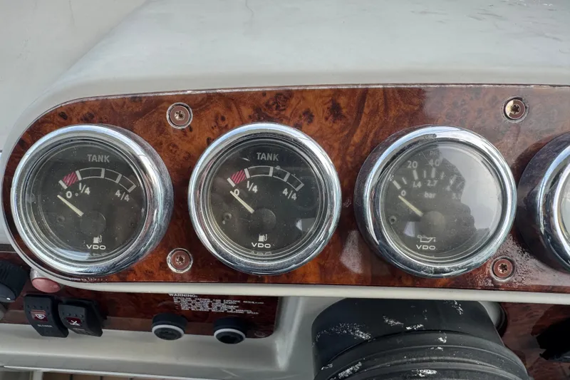 Slide: The Image of Dashboard gauges of a 2003 Formula 37 Performance Cruiser boat. - 34