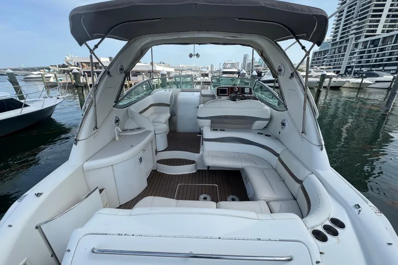 Slide: The Image of 2003 Formula 37 Performance Cruiser interior at marina, featuring spacious seating and helm. - 17