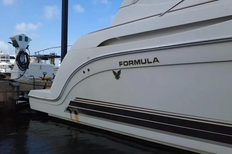 Slide: The Image of 2003 Formula 37 Performance Cruiser docked at marina, side view. - 13