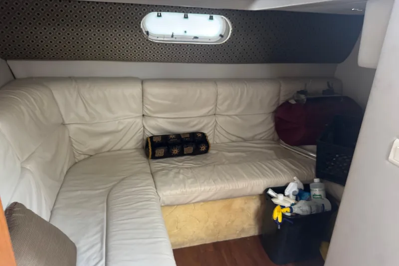 Slide: The Image of Interior of 2003 Formula 37 Performance Cruiser with white leather seating and porthole window. - 56