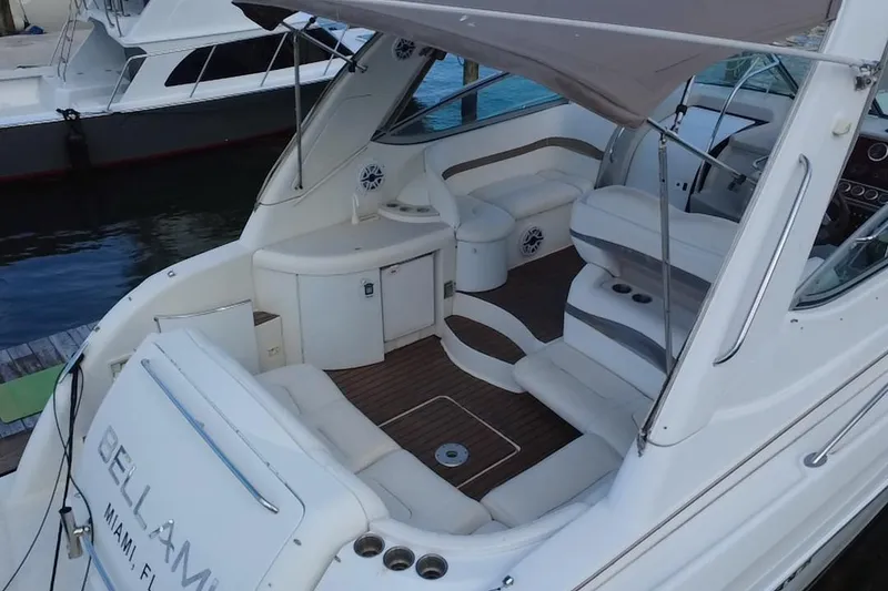 Slide: The Image of 2003 Formula 37 Performance Cruiser with spacious seating and sleek design, docked in Miami. - 14