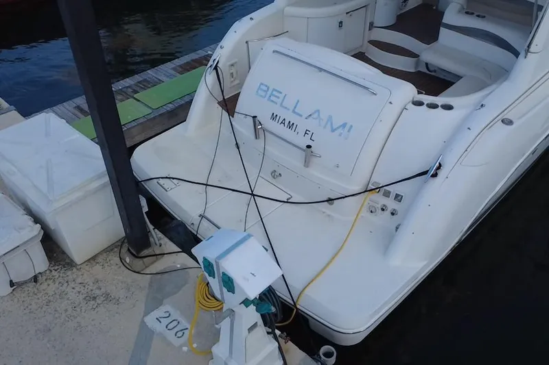 Slide: The Image of 2003 Formula 37 Performance Cruiser docked, rear view with "Bellami" and "Miami, FL" visible. - 3