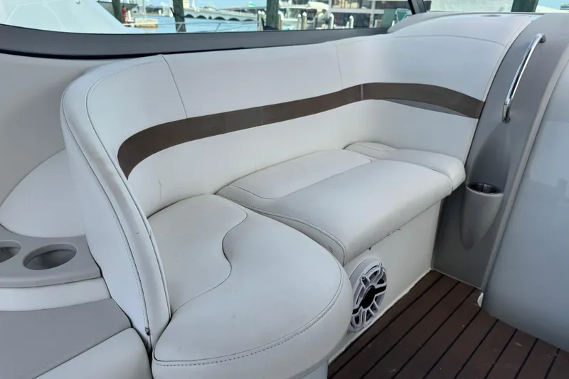 Slide: The Image of 2003 Formula 37 Performance Cruiser interior seating with white upholstery and cup holders. - 28