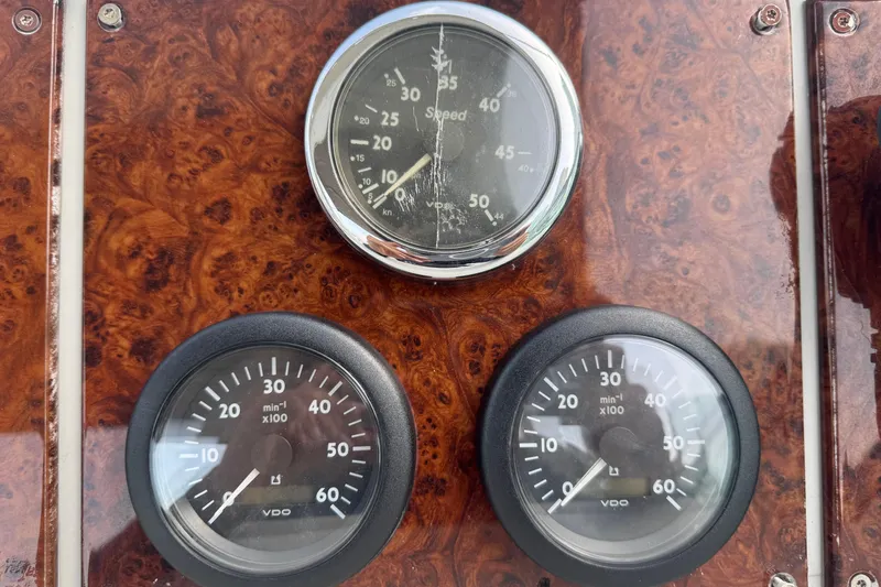 Slide: The Image of Dashboard gauges of a 2003 Formula 37 Performance Cruiser boat. - 37
