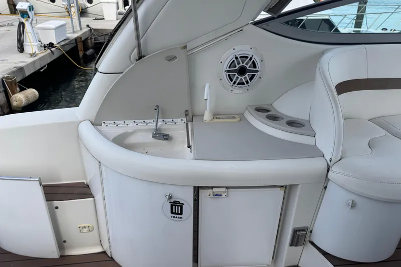 Slide: The Image of 2003 Formula 37 Performance Cruiser interior with sink, speaker, and seating area. - 20
