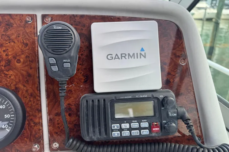 Slide: The Image of Control panel of a 2003 Formula 37 Performance Cruiser with Garmin and Icom devices. - 38