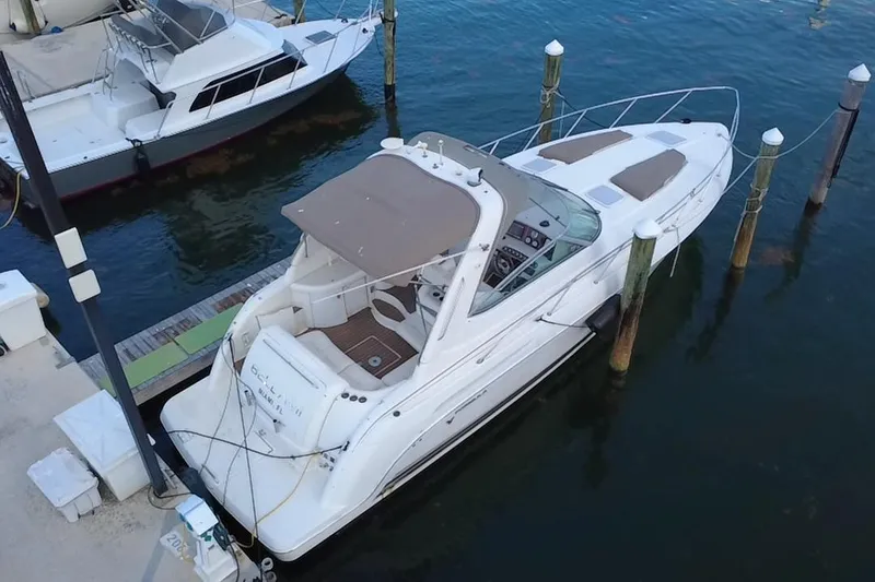 Slide: The Image of 2003 Formula 37 Performance Cruiser docked at marina, aerial view. - 2
