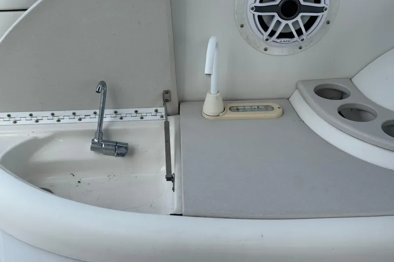Slide: The Image of 2003 Formula 37 Performance Cruiser sink area with faucet and speaker. - 21