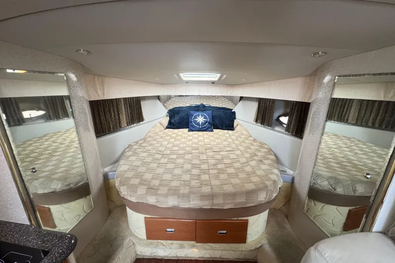 Slide: The Image of Interior of 2003 Formula 37 Performance Cruiser with cozy bed and nautical decor. - 44