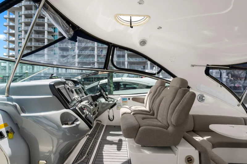 Slide: The Image of Interior of 2005 Cruisers Yachts 520 Express with modern helm and plush seating. - 35
