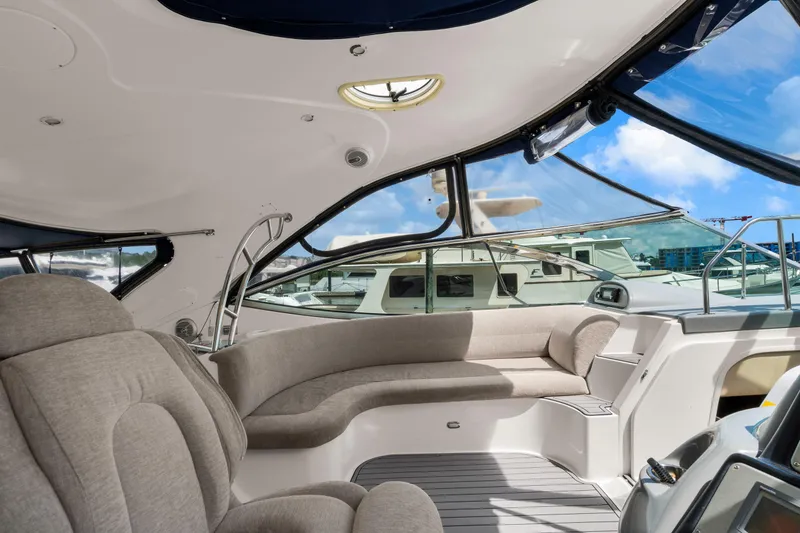 Slide: The Image of Luxurious interior of 2005 Cruisers Yachts 520 Express with plush seating and panoramic windows. - 32