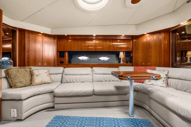 Slide: The Image of Luxurious interior of 2005 Cruisers Yachts 520 Express with plush seating and elegant wood finishes. - 13