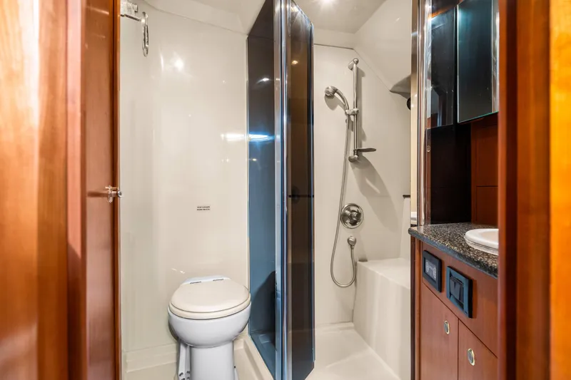 Slide: The Image of Luxurious bathroom in 2005 Cruisers Yachts 520 Express with shower and modern fixtures. - 26