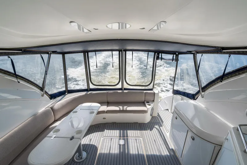 Slide: The Image of Luxurious interior of 2005 Cruisers Yachts 520 Express with panoramic windows and seating. - 39