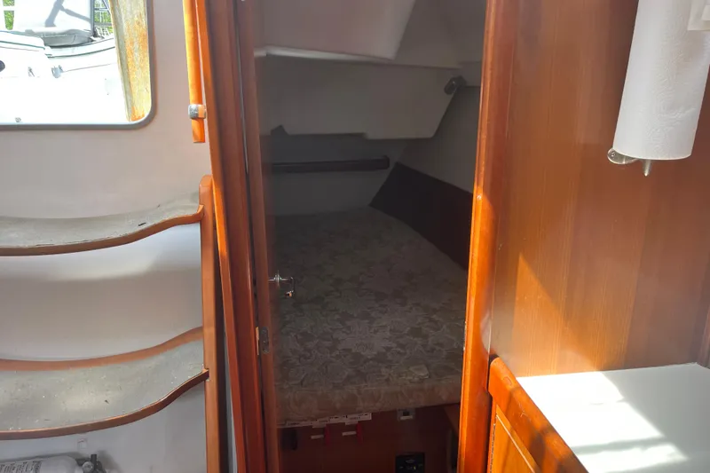 Slide: The Image of Interior cabin of 2006 Beneteau Oceanis Clipper 373 sailboat, featuring cozy sleeping area. - 28