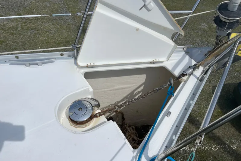 Slide: The Image of Anchor locker of 2006 Beneteau Oceanis Clipper 373 sailboat with chain and windlass. - 13
