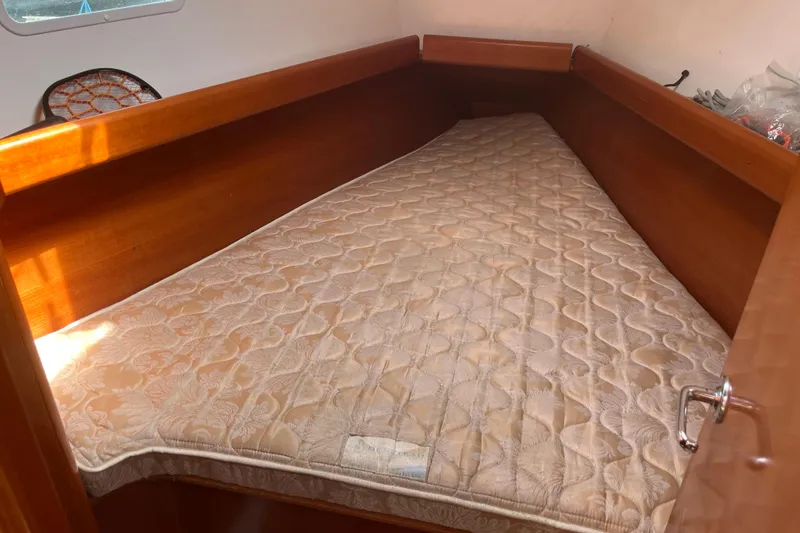 Slide: The Image of Cozy cabin bed in 2006 Beneteau Oceanis Clipper 373 sailboat interior. - 23