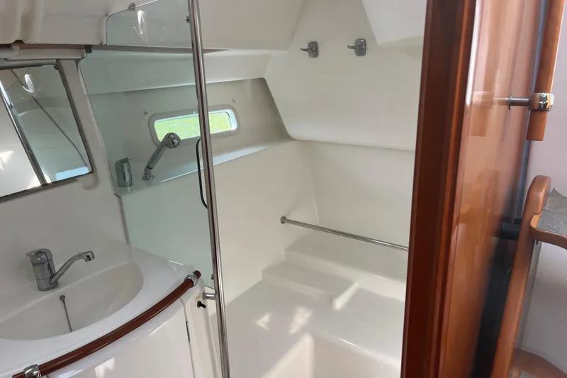 Slide: The Image of Interior of 2006 Beneteau Oceanis Clipper 373 yacht bathroom with sink and shower. - 16