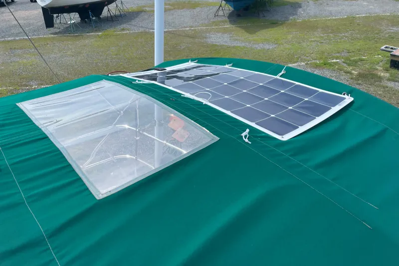 Slide: The Image of Solar panel and hatch on 2006 Beneteau Oceanis Clipper 373 sailboat deck. - 12